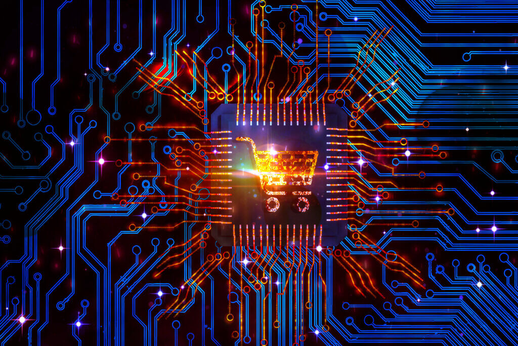 Retail A digital circuit board with glowing blue and orange lines, featuring a shopping cart icon at the center, symbolizing e-commerce and technology integration.