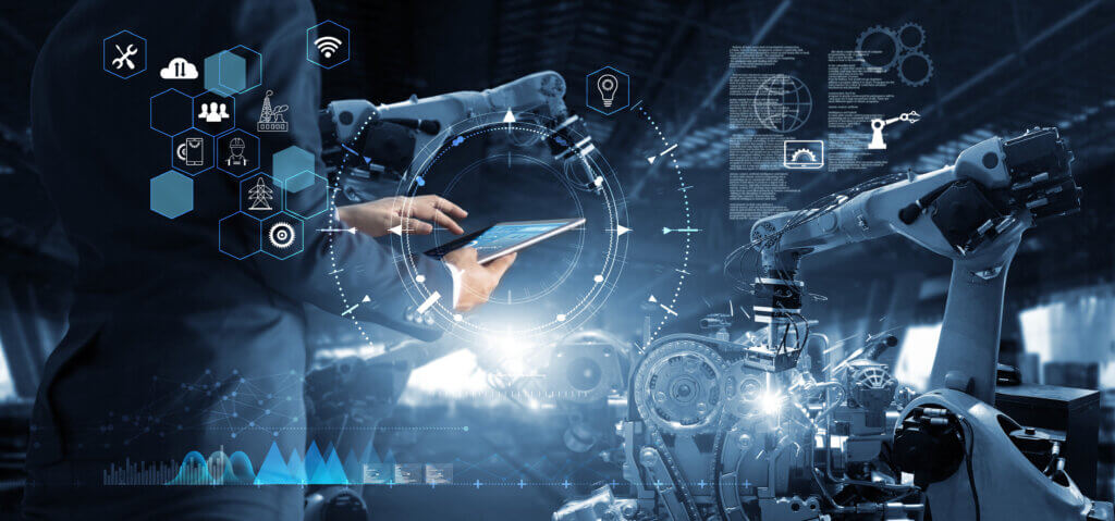 Manager Technical Industrial Engineer working and control roboti A technician interacting with a large digital display while working with industrial robotic machinery.
