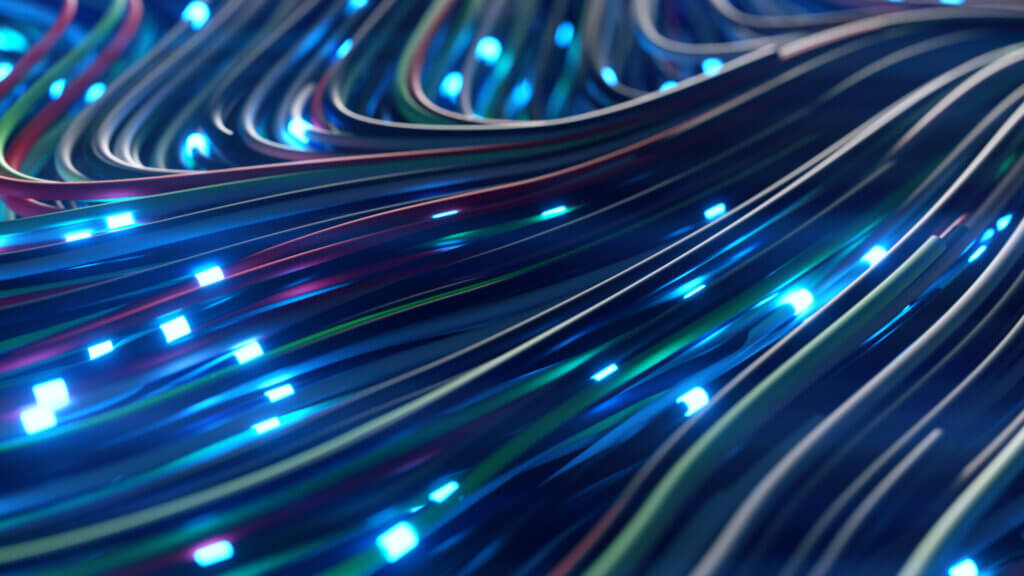 Marble, North Carolina A close-up of glowing multicolored fiber optic cables illuminated with blue light, creating a dynamic, flowing effect.