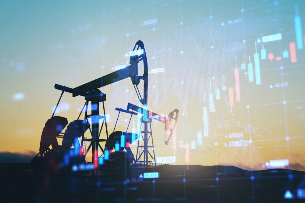 Oil & Gas Silhouette of an oil pump jack against a backdrop of stock market data and graphs.